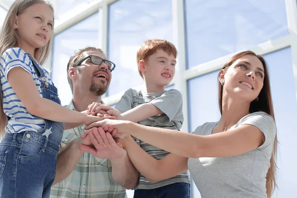 Close up. a happy family looks forward to something — Stock Photo, Image