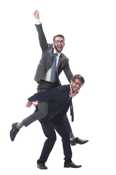 Homem de negócios feliz carregando seu colega no piggyback — Fotografia de Stock