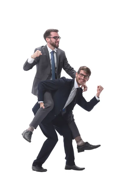 Homem de negócios feliz carregando seu colega no piggyback — Fotografia de Stock