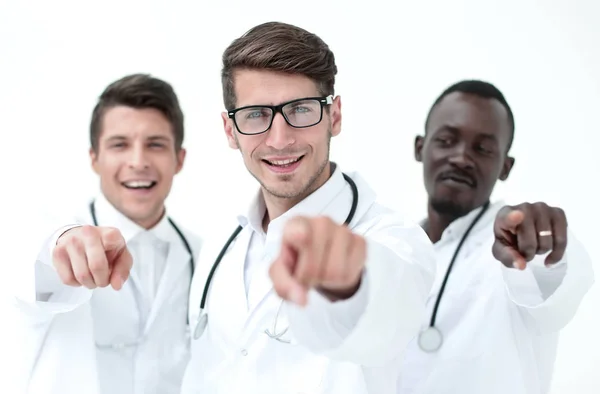 Group of successful doctors pointing to you. — Stock Photo, Image