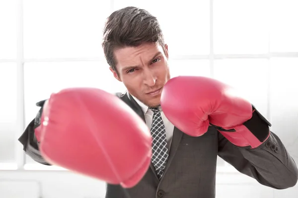 Confident young businessman in Boxing gloves — Stock Photo, Image