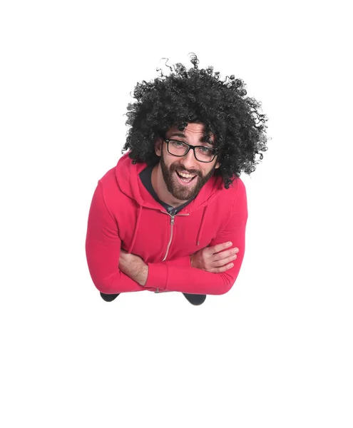 Κορυφαία προβολή. χαρούμενο σγουρά μαλλιά τύπος κοιτάζοντας την κάμερα — Φωτογραφία Αρχείου