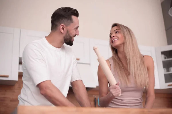 Close up. young couple preparing croissants together — Stock Photo, Image