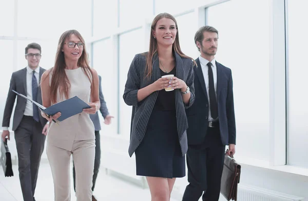Business people going along the office corridor during working day — Stock Photo, Image