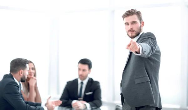 Serious businessman standing in the office and pointing at you — Stock Photo, Image