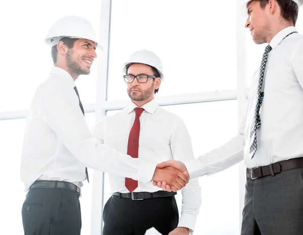 Two architects shaking hands after a meeting in office — Stock Photo, Image