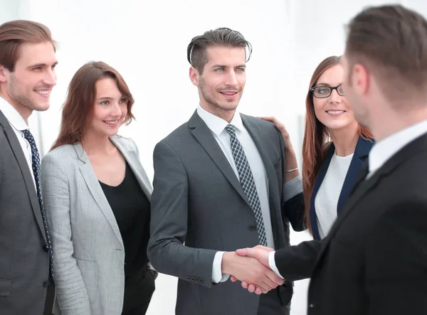 Handshake in the lobby of an office building — Stock Photo, Image