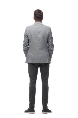 arka görünüm. boş ekrana bakan genç adam