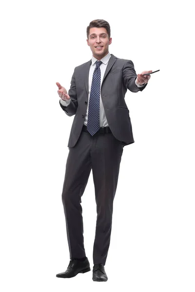 Vriendelijke succesvolle zakenman met een smartphone. geïsoleerd op grijze achtergrond — Stockfoto