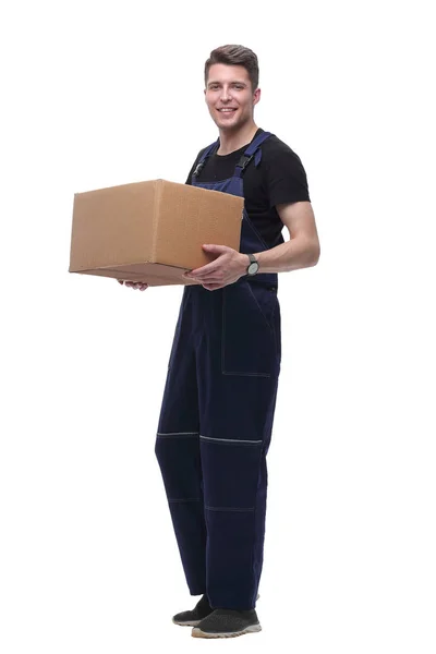 Man in overalls with a cardboard box. isolated on white — Stock Photo, Image