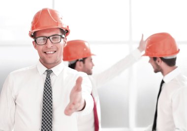 bir el sıkışma için uzanarak up.architect kapatın