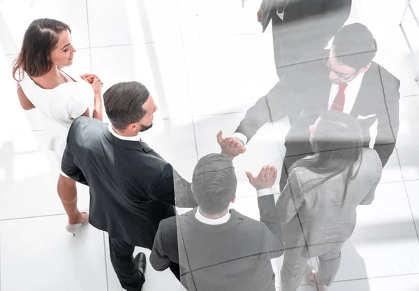 Top view. business partners stretching out their hands for a handshake — Stock Photo, Image