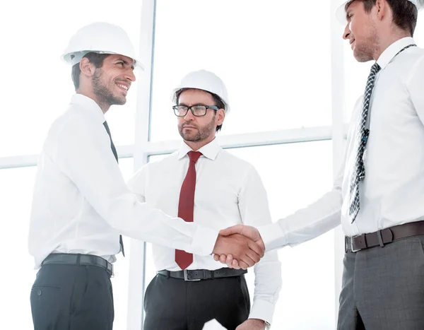 Two architects shaking hands after a meeting in office — Stock Photo, Image