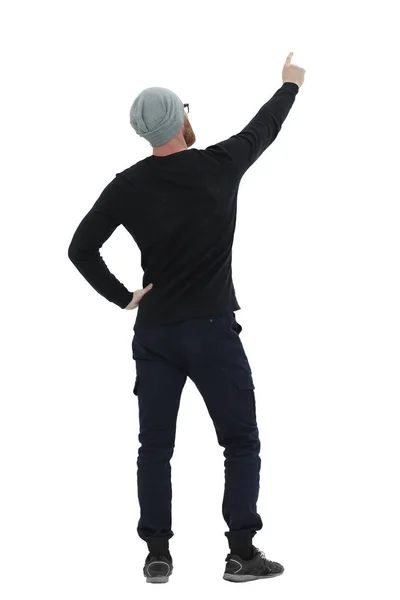 Rear view. confident athletic man pointing to blank screen — Stock Photo, Image