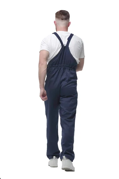 In full growth. confident man in overalls goes forward. — Stock Photo, Image