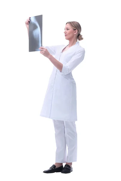 Competent woman doctor looking at x-ray. isolated on white — Stock Photo, Image