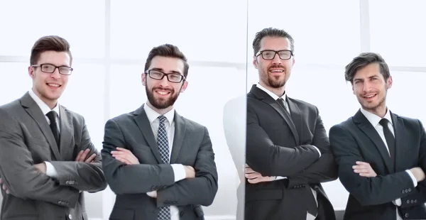 Group of confident business people standing in the office — Stock Photo, Image