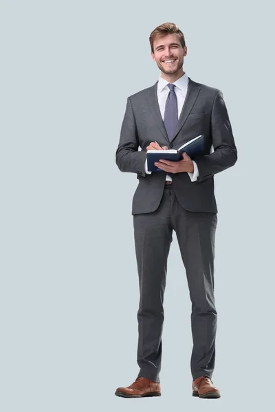 In full growth. successful businessman with a notebook. — Stock Photo, Image