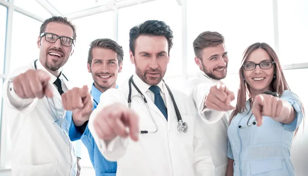 Portrait of doctors pointing at you