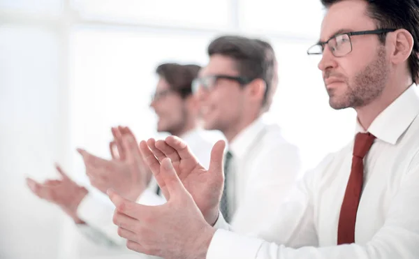 Group of business people applauding sitting at the office table. — Stock Photo, Image