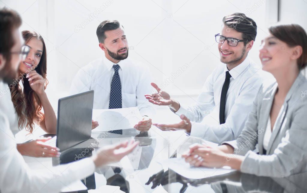 business colleagues discussing their ideas at a meeting in the office.