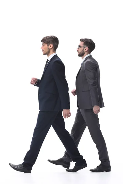 Side view. two young businessmen stepping forward. — Stock Photo, Image