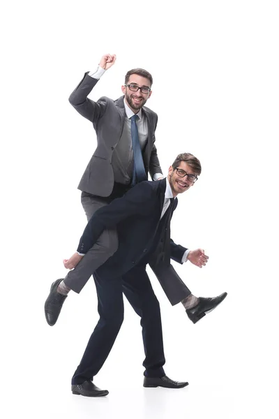 Ευτυχισμένος επιχειρηματίας κουβαλάει το συνάδελφό του στην πλάτη του. — Φωτογραφία Αρχείου