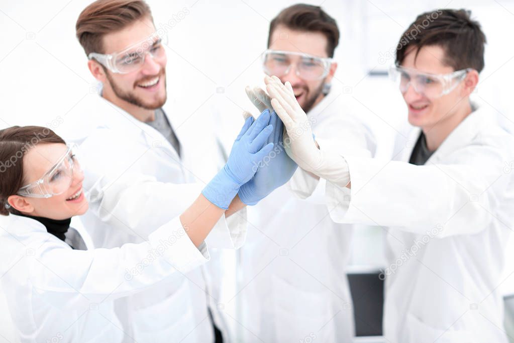 scientists giving each other a high five