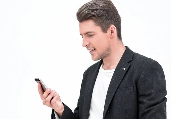 Close up. smiling businessman looking at the smartphone screen — стоковое фото