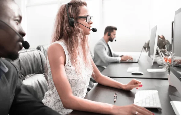 Call center staff at the Desk in the business center — Stock Photo, Image