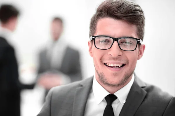 Close up. the face of a young businessman in the office. — Stock Photo, Image