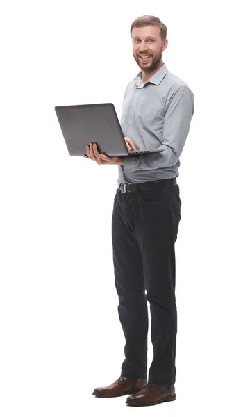 In volle groei. lachende jonge zakenman met laptop. — Stockfoto