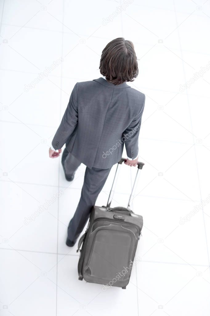 businessman with a road suitcase.isolated on white.