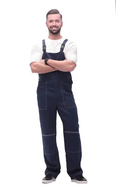 Side view. smiling man in overalls looking forward to copy space — Stock Photo, Image