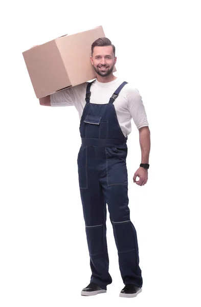 I full tillväxt. en man i overaller med en låda på axeln — Stockfoto