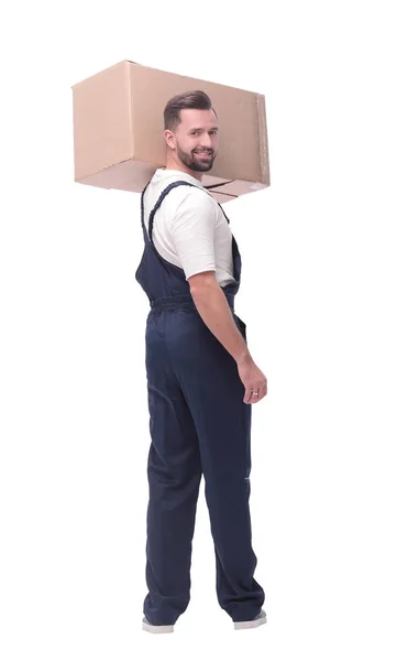 Rear view. a young man with a cardboard box looking at the camera — Stock Photo, Image