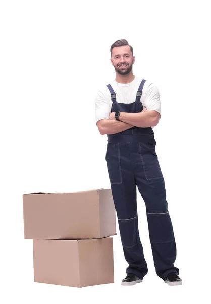 Em pleno crescimento. sorrindo homem de pé perto de caixas de papelão — Fotografia de Stock