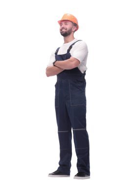 Tam gelişim. Tulumlu ve kasklı gülümseyen adam.