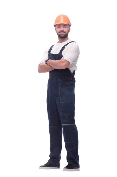 In full growth. smiling man in overalls and a safety helmet — Stock Photo, Image