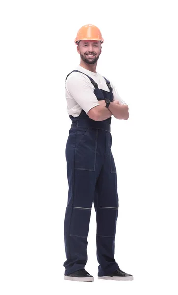 In vollem Wachstum. Lächelnder Mann in Overalls und Schutzhelm — Stockfoto