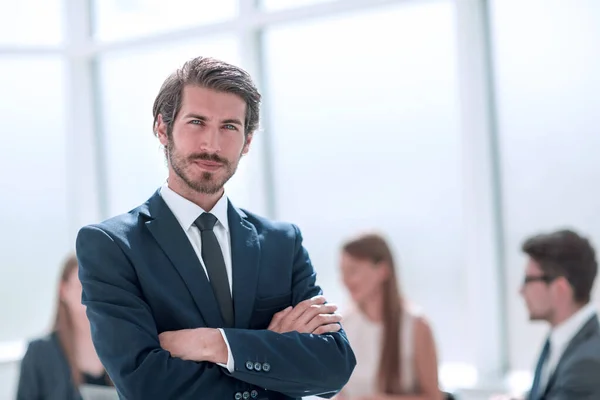 Confident young business man standing in office — Stock Photo, Image