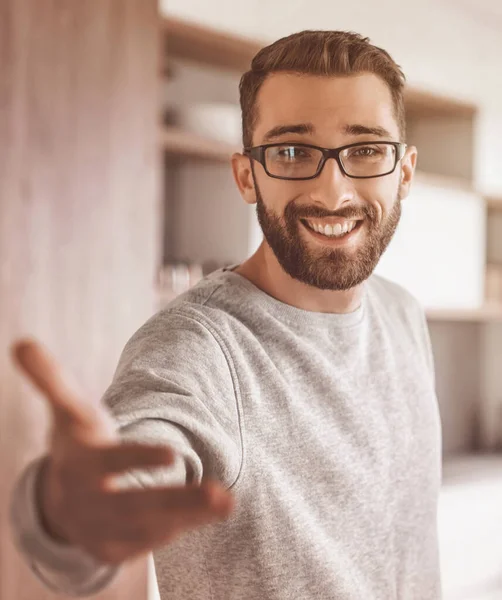 close up.young man standing in the kitchen