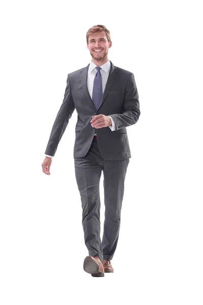 Smiling young business man confidently goes forward — Stock Photo, Image