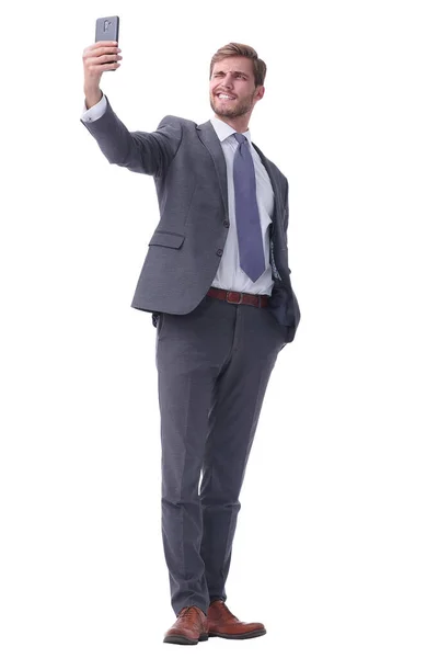 In full growth. smiling businessman taking selfie. — Stock Photo, Image