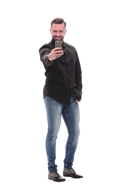 En pleno crecimiento. un joven en jeans tomando selfies — Foto de Stock