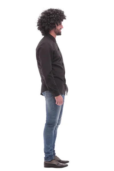 Zijaanzicht. lachende kerel in jeans. geïsoleerd op wit — Stockfoto