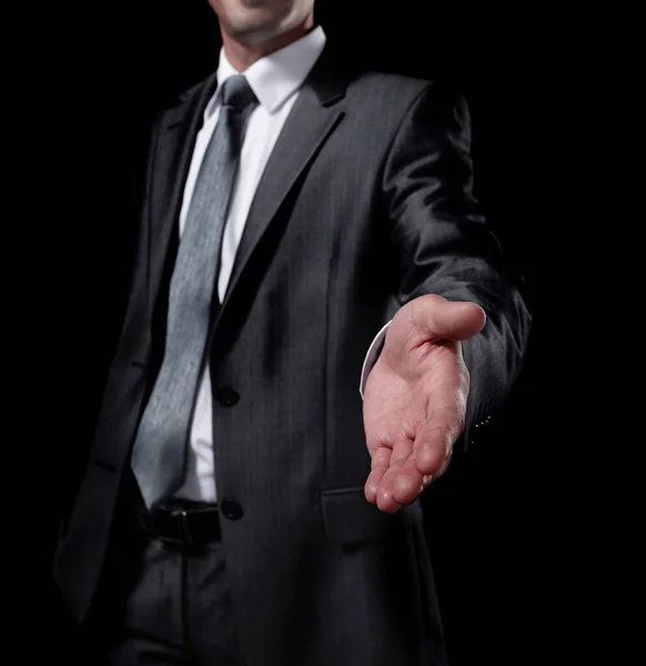 Businessman holding out hand for a handshake — Stock Photo, Image