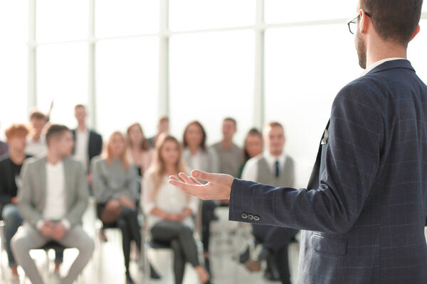 close up. speaker standing in front of the audience in the conference room