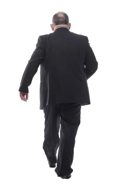Senior businessman confidently stepping forward. isolated on a white — Stock Photo, Image