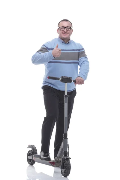 In piena crescita. moderno uomo maturo con scooter elettrico — Foto Stock